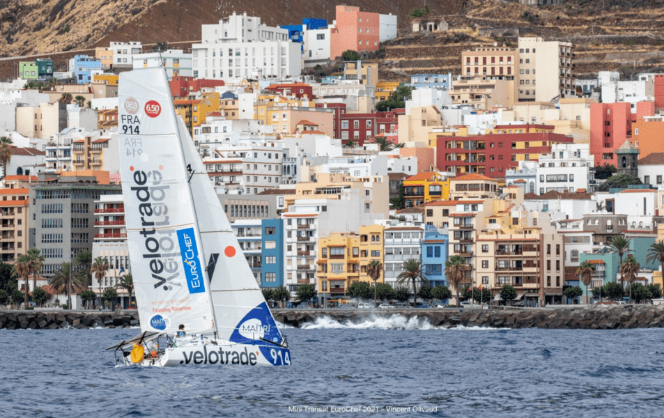 Velotrade sailboat sailing across Santa Cruz de La Palma during Mini Transat Leg 1 race.